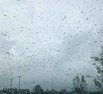 Window With Rain Drops And Cloudy Sky GIF