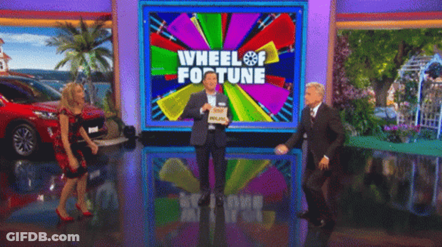 Winner Wheel Of Fortune Throwing Confetti GIF