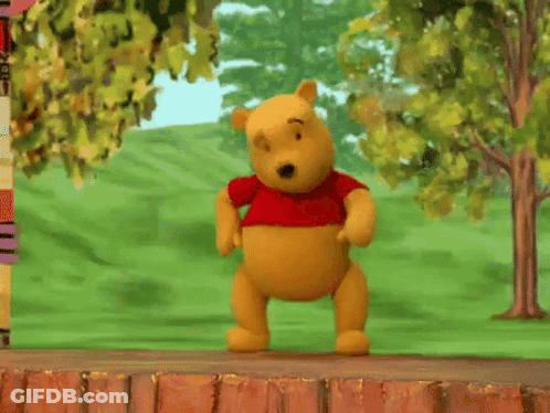 Winnie The Pooh Doll Laying On Brick Wall GIF