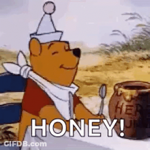 Winnie The Pooh Is Sitting At A Table Holding A Spoon Next To A Jar Of Honey . GIF