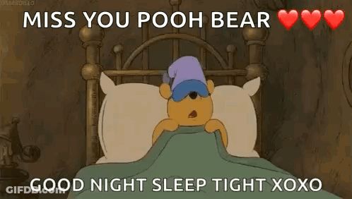 Winnie The Pooh Laying In Bed With Sleep Mask GIF