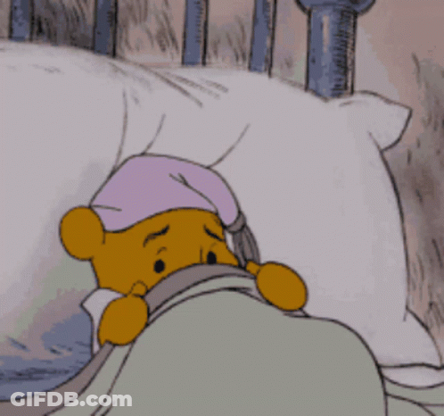Winnie The Pooh Lying In Bed With Purple Hat GIF