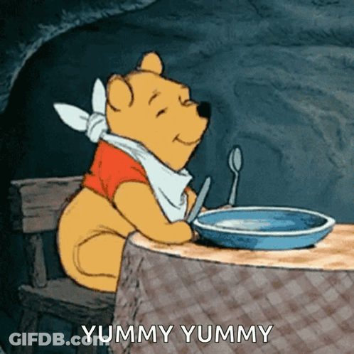 Winnie The Pooh Sitting At Table GIF