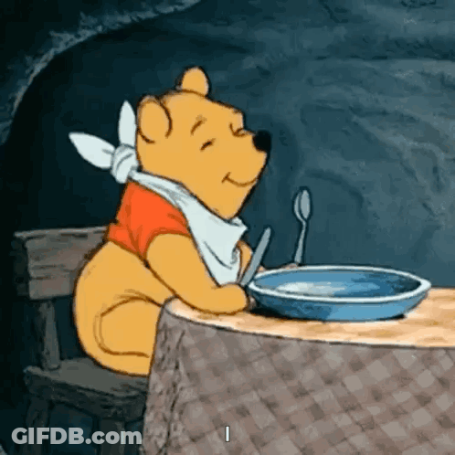 Winnie The Pooh Sitting At Table GIF