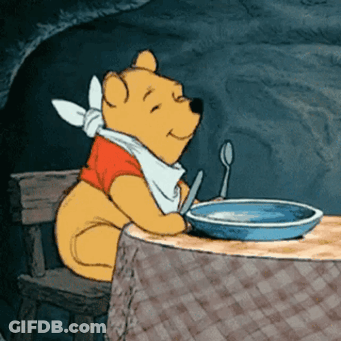 Winnie The Pooh Sitting At Table With Food GIF