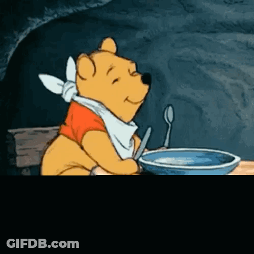 Winnie The Pooh Sitting At Table With Food GIF