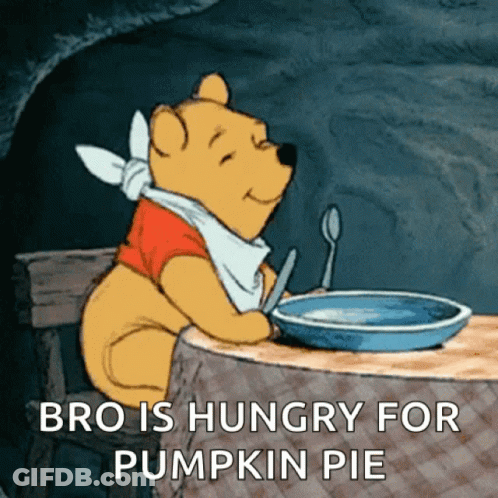 Winnie The Pooh Sitting At Table With Pumpkin Pie GIF