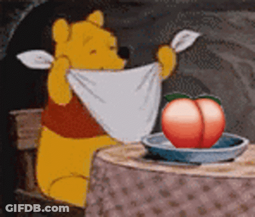 Winnie The Pooh Sitting At Table With Towel And Peach In Bowl GIF
