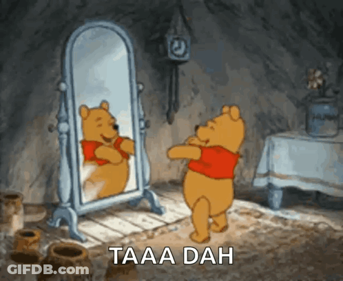 Winnie The Pooh Standing In Front Of Mirror Saying Taaa Dah GIF