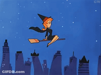 Witch On Broom Over City At Night GIF