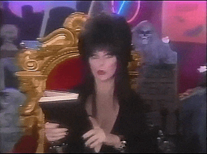 Witch Opening Book Of Spells GIF
