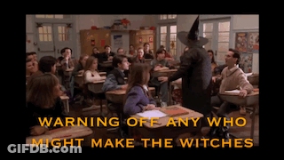 Witch Standing In Front Of Classroom Warning Off Any Who Might Make The Witches Below Her GIF