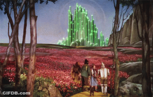 Wizard Of Oz Painting With Green Building In Distance GIF