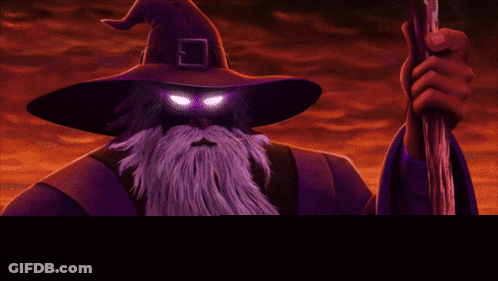 Wizard With Beard Holding Glowing Wand GIF
