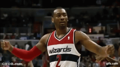 Wizards Basketball Player Arms Outstretched Before Crowd GIF