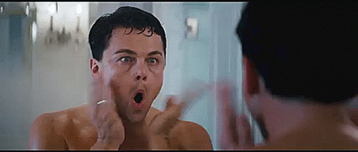 Wolf Of Wall Street Leonardo Tapping Cheeks GIF