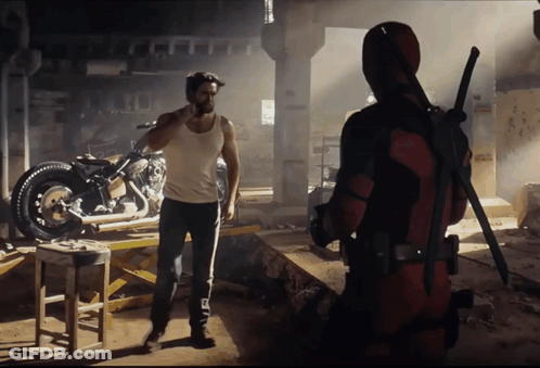 Wolverine And Deadpool Standing In Dark Room With Motorcycle GIF