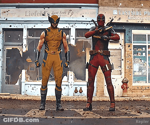 Wolverine And Deadpool Standing In Front Of Liefeld's Just Feel Building GIF