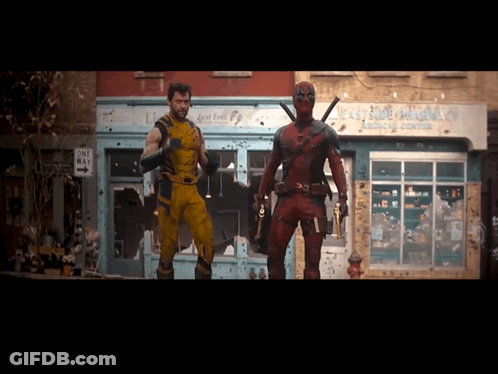 Wolverine And Deadpool Standing In Front Of One Way Store GIF