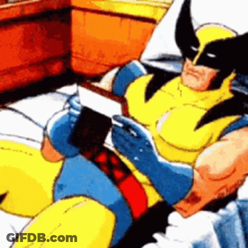 Wolverine Is Reading A Book While Laying On A Bed GIF
