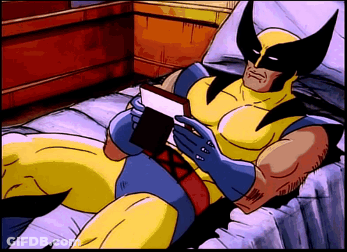 Wolverine Reading Book On Bed GIF