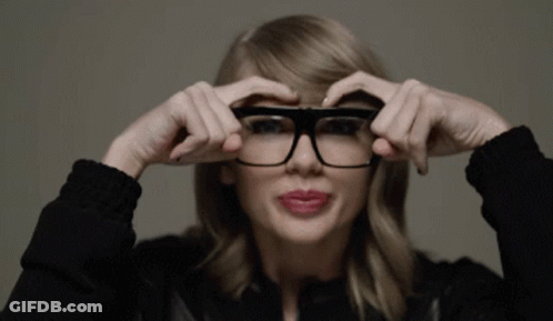Woman Adjusting Glasses In Black Jacket GIF
