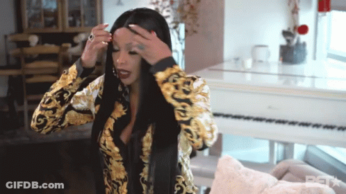 Woman Adjusting Hair At White Piano With BST GIF