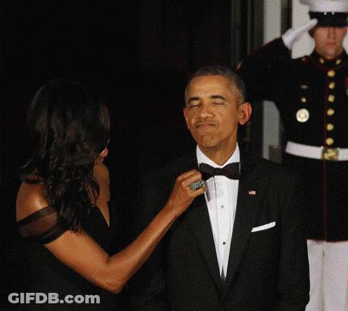 Woman Adjusting Man's Tie GIF