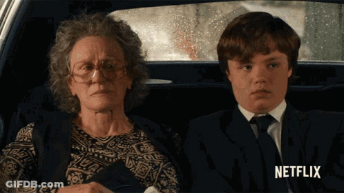 Woman And Boy Sitting In Car With Netflix GIF