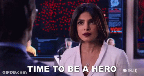 Woman And Man At Screen Saying Time To Be Hero GIF