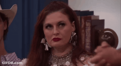 Woman And Man In Cowboy Hats With Earrings GIF