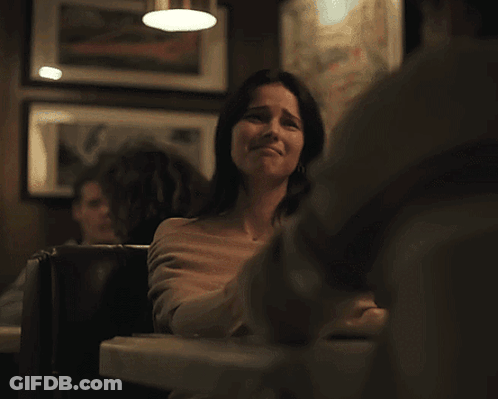 Woman And Man Sitting At Restaurant Table GIF