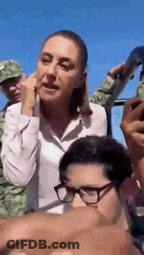 Woman And Man With Glasses Talking GIF