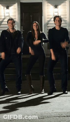 Woman And Two Men Dancing In Front Of House GIF