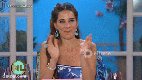 Woman Applauding At Table In Front Of Eltrece GIF