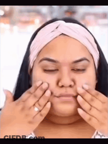 Woman Applying Cream To Face GIF