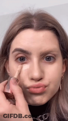 Woman Applying Foundation And Making Face GIF