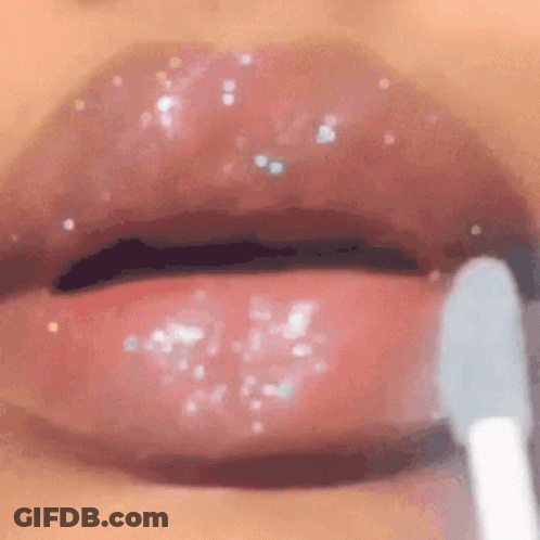 Woman Applying Lip Gloss GIF