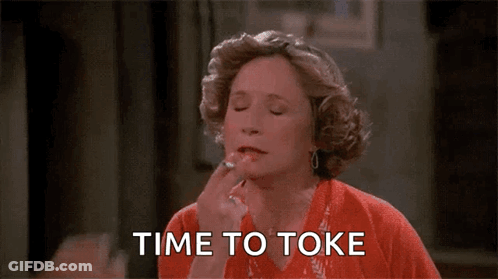 Woman Applying Lipstick Man Saying Time To Toke GIF