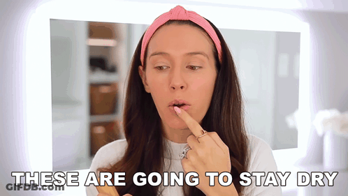 Woman Applying Lipstick Saying These Are Going To Stay Dry GIF