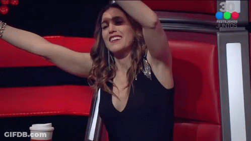 Woman Arms Outstretched In Front Of 30 Festejemos Juntos Sign GIF