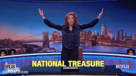 Woman Arms Outstretched In Front Of National Treasure Screen GIF