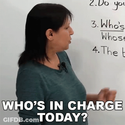 Woman Asking Who's In Charge Today At Whiteboard GIF