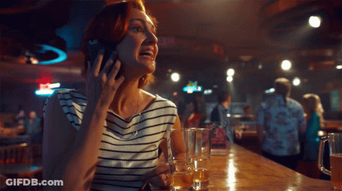 Woman At Bar On Phone Saying I Cannot GIF