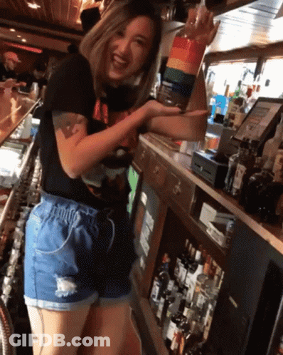Woman At Bar With Alcohol Bottles GIF