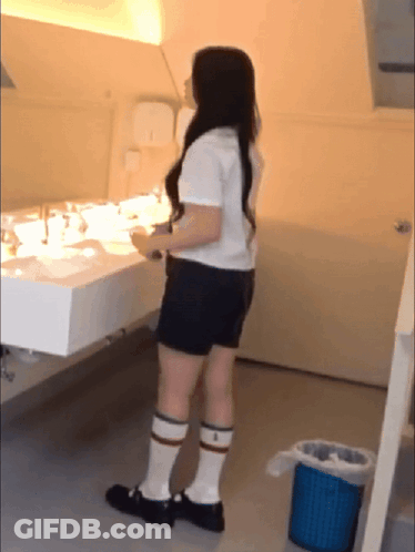 Woman At Bathroom Sink GIF