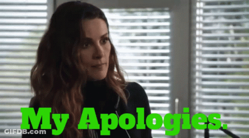 Woman At Blinds Saying My Apologies In Green GIF
