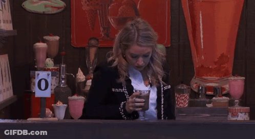 Woman At Counter With O Sign GIF