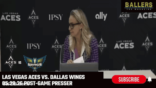Woman At Desk In Front Of Las Vegas Aces Vs Dallas Wings Wall GIF