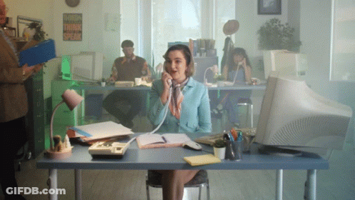 Woman At Desk Talking On Phone With Sign Words Think Speak GIF